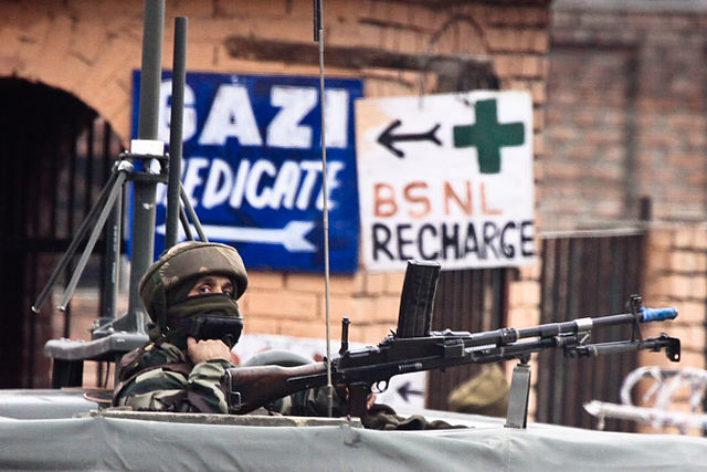 An Indian soldier guards the roadside checkpoint outside Srinagar International Airport (2009).